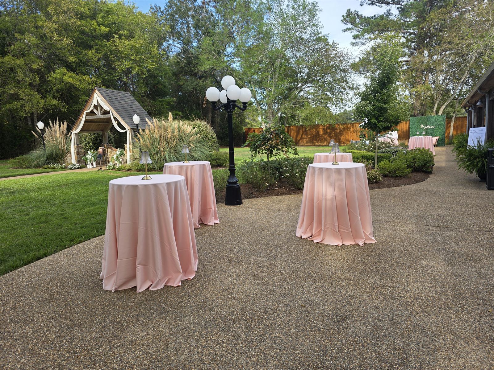 Blush cocktail tables on the garden patio