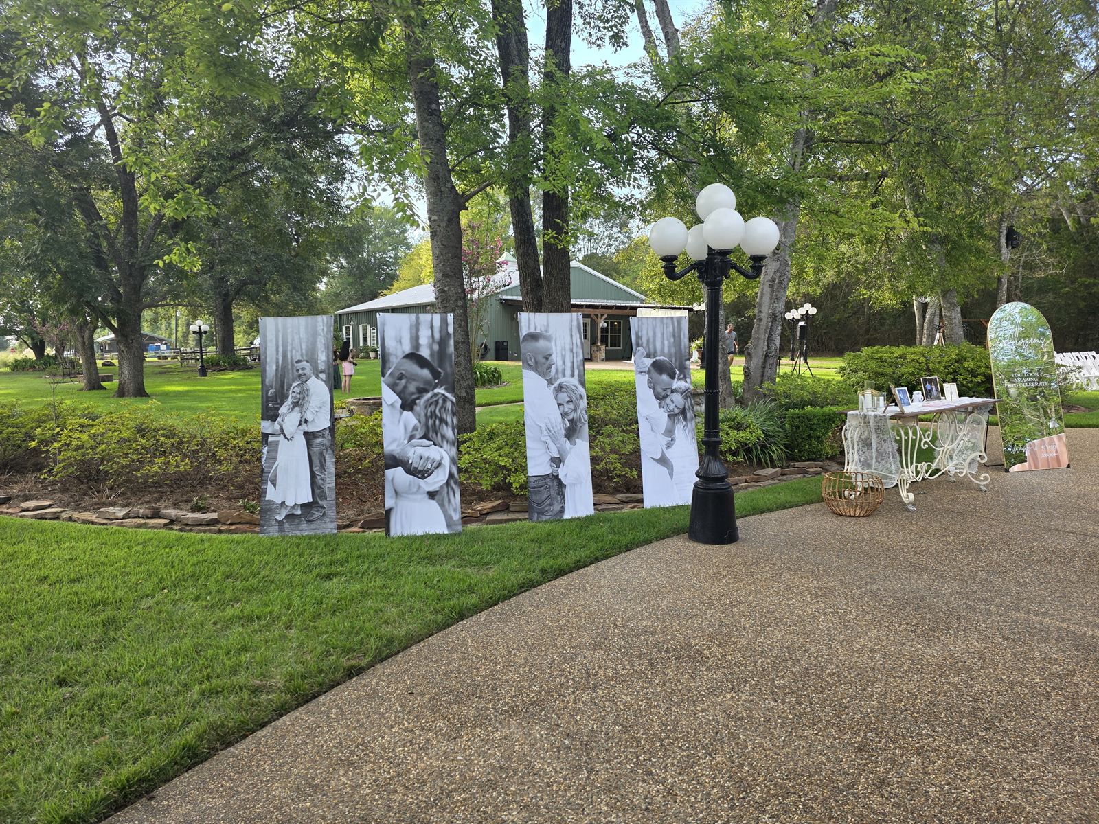 Black and white photo display panels along the garden walk